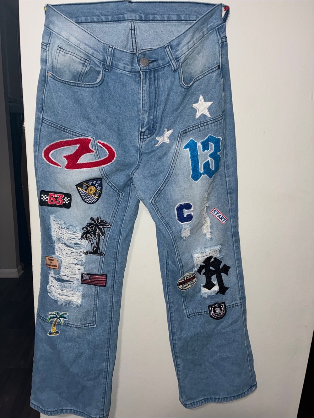 Light Blue Patchwork Men’s Jeans with Distressed Detailing